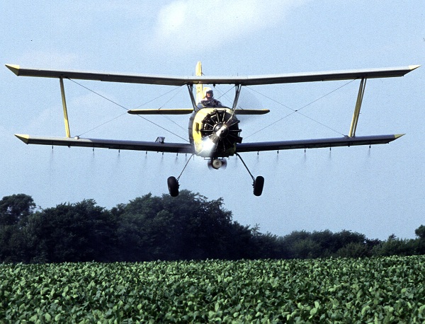  Near Sheldon, Illinois, grower Joe Zumwalt applies a low-insecticide bait that is targeted against western corn rootworms feeding on and laying eggs in these soybeans.